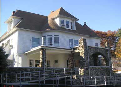 Shingle style house with fieldstone