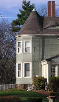 Two-story tower bay on a Shingle Style house