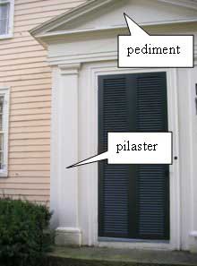 Door surround with pilaster and pediment on a Federal house