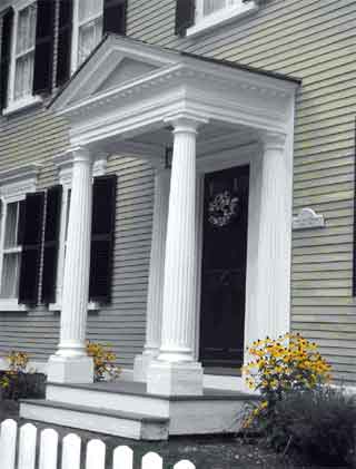 This portico is supported by columns and surmounted by a pediment.