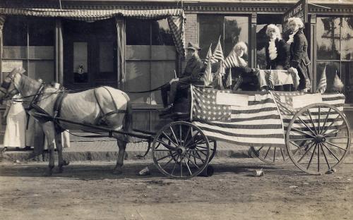 July 4, c-1907 Horribles Parade float in front to Howell Block