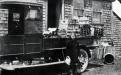 Plant house - Mary Rennie in front of truck circa 1920