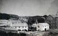 Circa 1875 - earlier mill buildings on both sides of the river next to the dam 